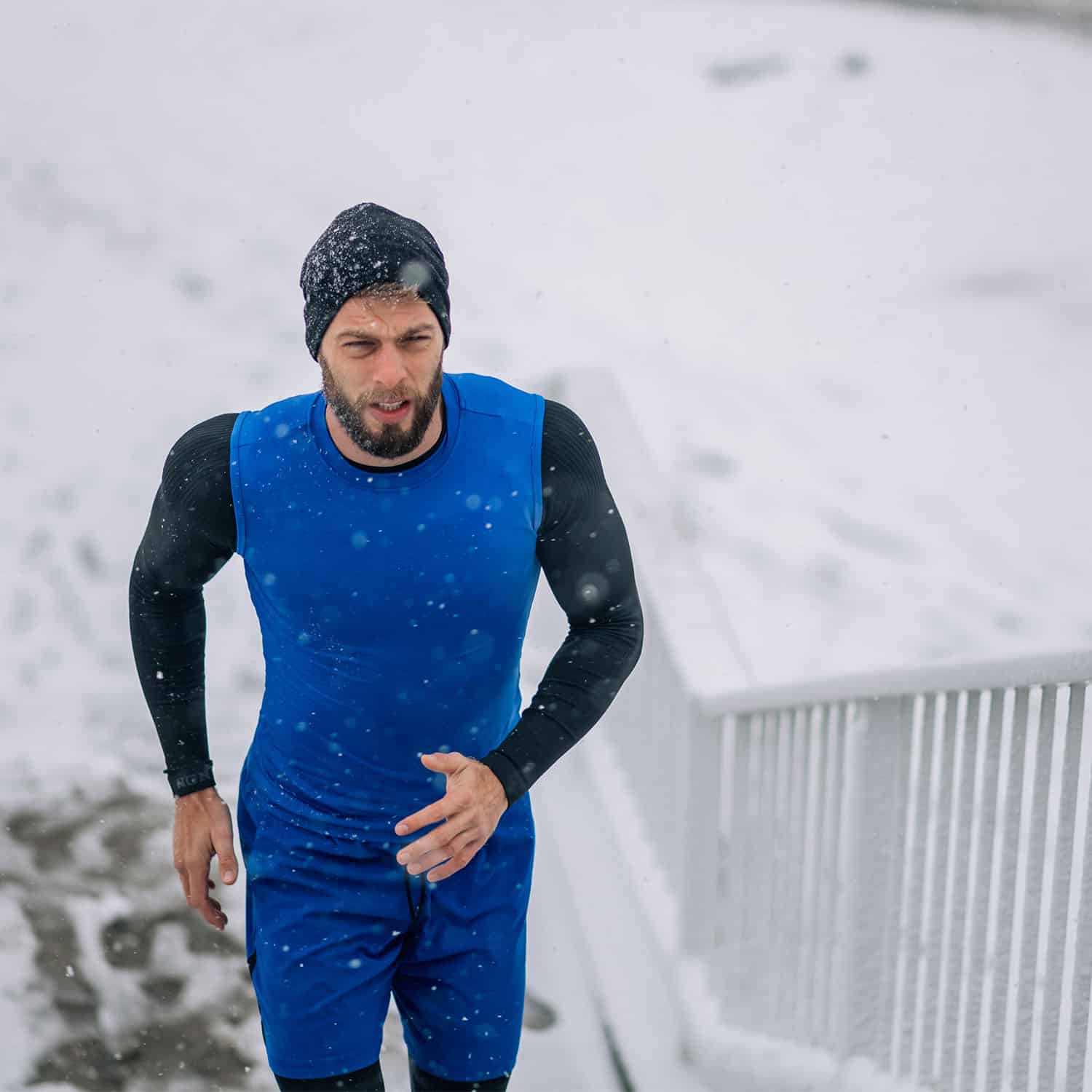 man-running-on-a-stairs-on-a-cold-winter-day-2023-11-27-05-05-35-utc